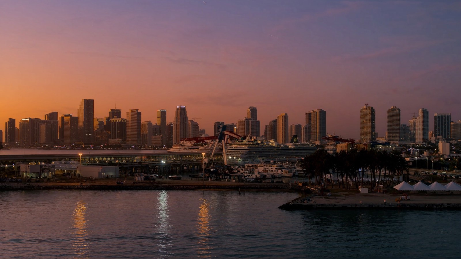 The Miami skyline and cruise terminal at dusk, seen from Biscayne Bay